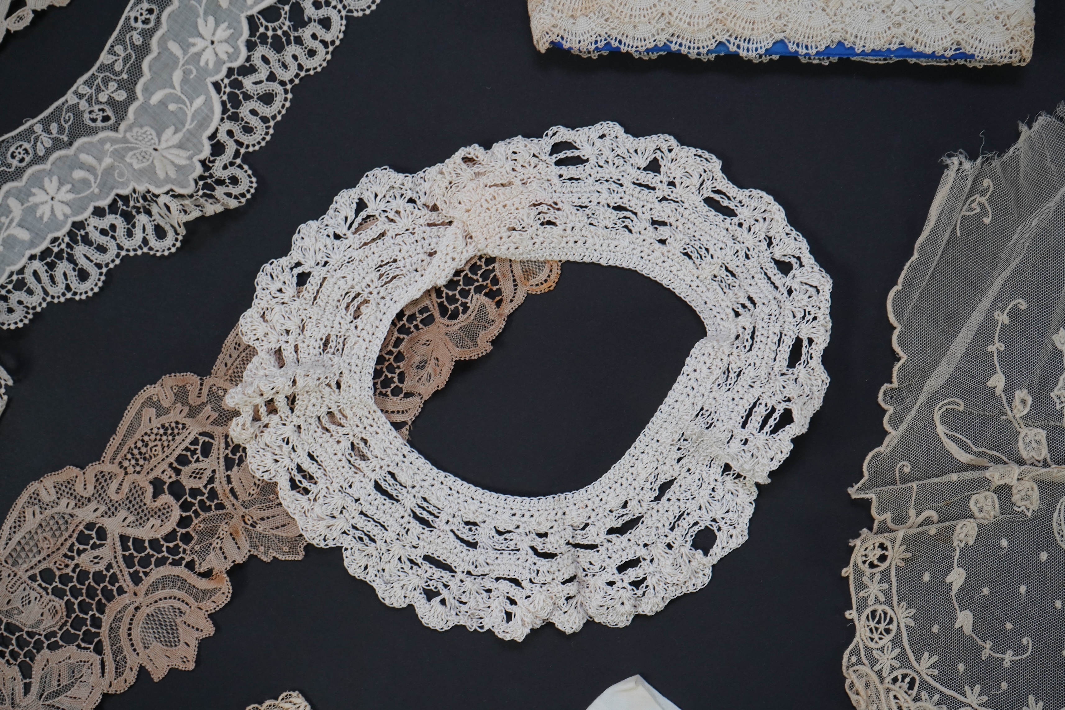 A variety of 19th and 20th century cream lace, being mixed hand and machine collars, lappets, trimmings together with a silk stole. Ideal for tv, film and theatre, stole 230 cm long. Condition - good